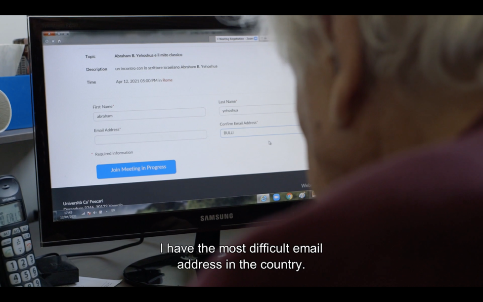 An old man with white hair looks at his computer screen. The caption reads "I have the most difficult email address in the country."