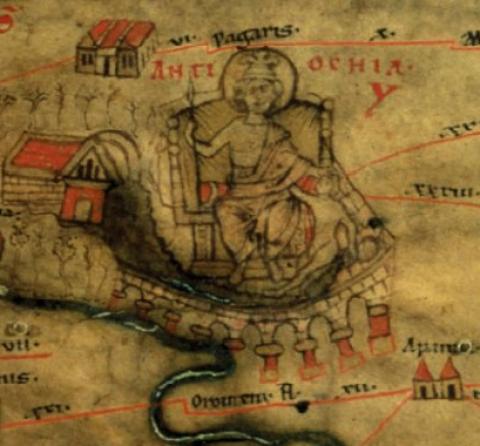 A hand-drawn map on yellowed parchment with drawings of buildings and an aqueduct. In the center, a togaed man sits on a throne with a spear in his right hand and a halo behind him, indicating his sainthood. Red text behind his head reads ANTIOCHIA.