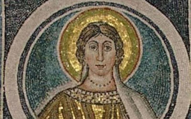 A mosaic with a black background. The top reads SCA PERPETUA. Beneath that is a bust image of a woman in a circle. She has brown hair pulled back, wears gold robes, and has a gold saint halo around her head.