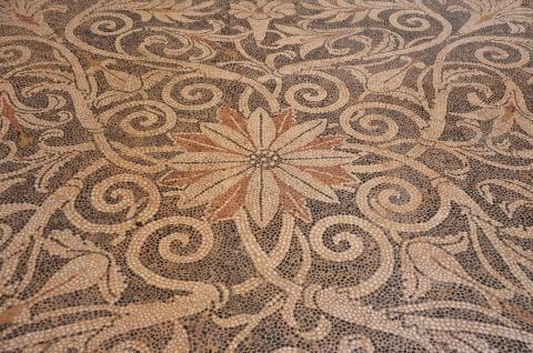 "Pebble mosaic floor with floral decoration, from Ancient Sikyon, second half of 4th century BC, Archaeological Museum of Sikyon, Greece" by Following Hadrian is licensed under CC BY-SA 2.0.