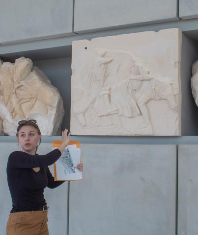 A graduate student lecturing at the Acropolis Museum