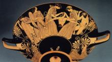 A Greek red-figure cup depicting the disembodied torso of a man, arms outstretched, and women on either side holding the torso
