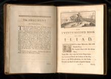 An old book opened to show a page entitled "The Twenty-Second Book of the Iliad"