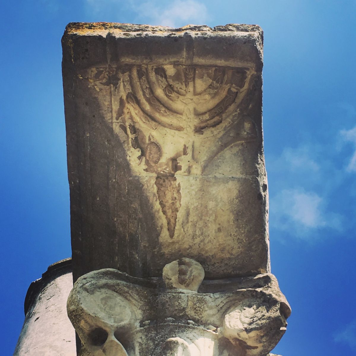 Detail of a menorah found on a column at the Synagogue at Ostia Antica. Image by Catherine Bonesho, unpublished.